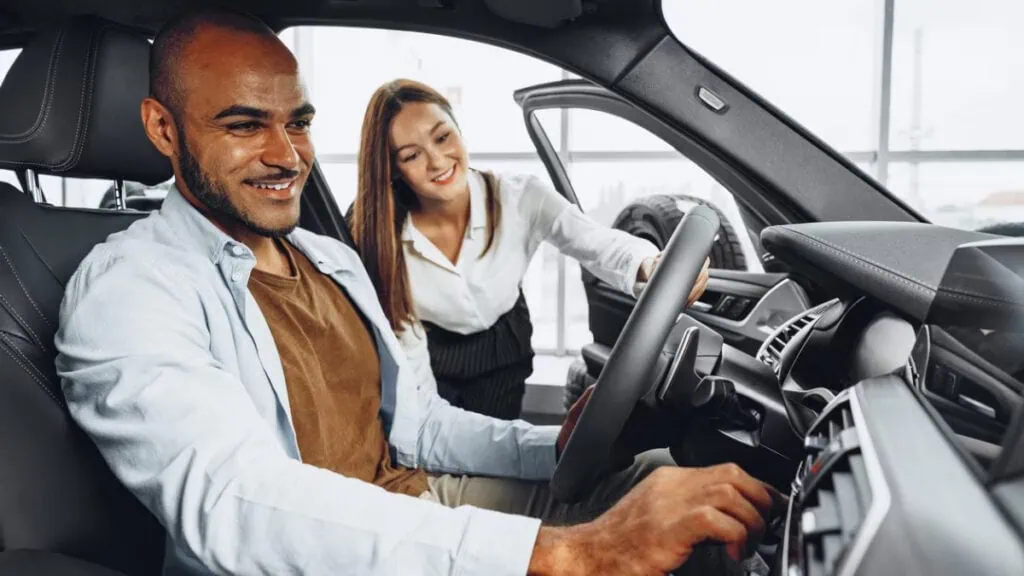 A man and woman in a car smiling, featuring Data Field Technology Services and highlighting their expertise in innovative tech solutions.