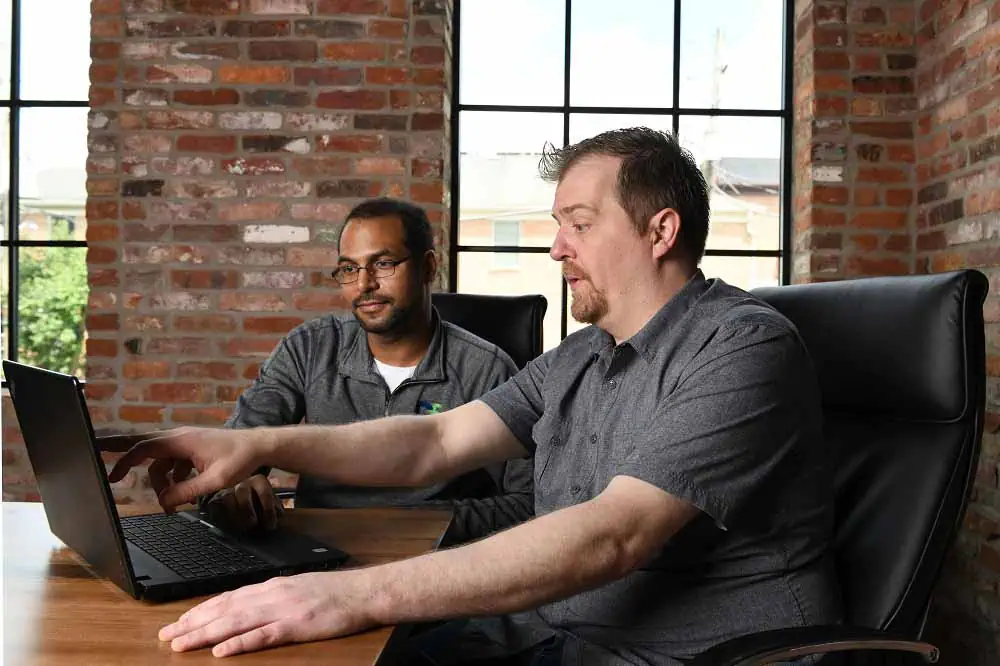 Office scene showcasing DataField Technology Services with a focus on Background Checks, seamlessly integrated to complement the page's context.