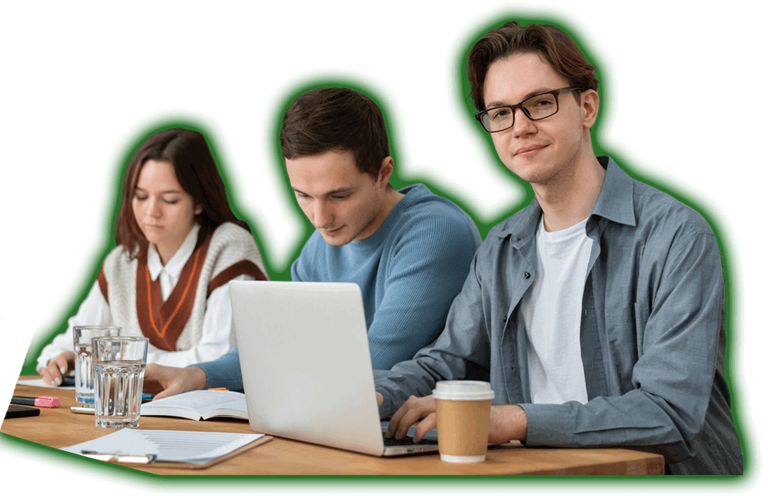 Three people working on laptops in a classroom, featuring Data Field Technology Services and highlighting their expertise in innovative tech solutions.